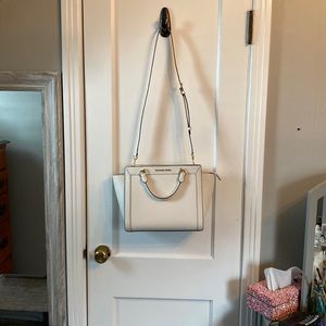 Michael Kors white with gold accent handbag.